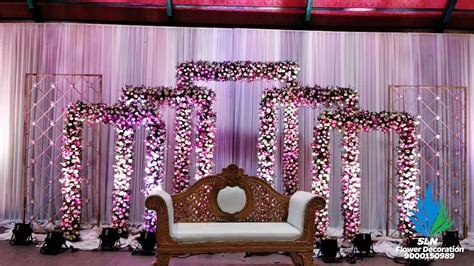 Wedding center stage decoration has the main importance in any wedding. SLN Flower Decoration | Stage decorations