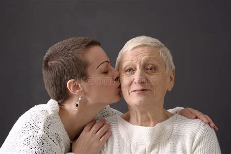 Mature Woman Giving A Kiss At Senior Woman Stock Image Image Of Tenderness Horizontal 9086851