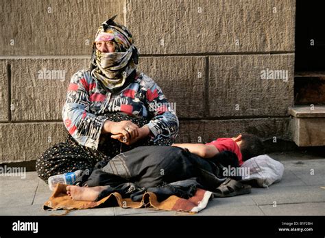 Gypsy Woman Begging On The Streets Of Istanbul Turkey Stock Photo