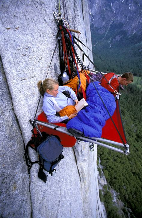 A Couple Of Rock Climbers Portaledge Camping On A Mountain Side In