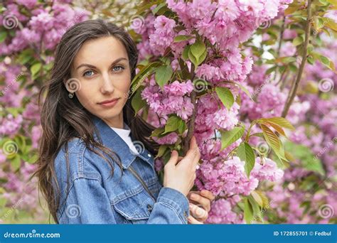 Pretty Woman In Pink Cherry Blossom Portrait Of Girl With Spring