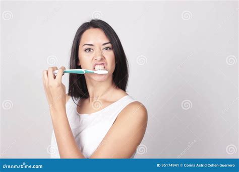 Young Woman Brushing Her Teeth Isolated Over White Background Stock Image Image Of Fresh