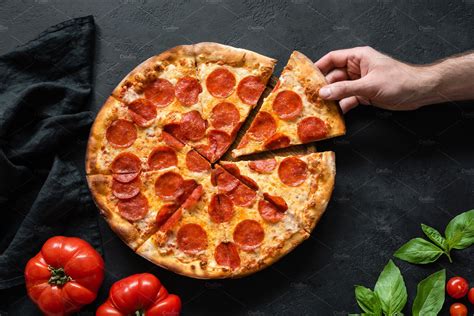 Hand Picking Slice Pepperoni Pizza High Quality Food Images