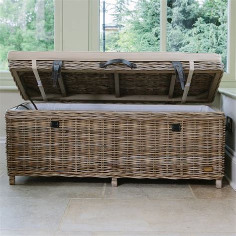 This product is made with natural teak. Cove Rustic Rattan Bench
