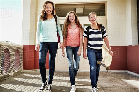 Teenage Girls Walking On School Campus Stock Photo Dissolve