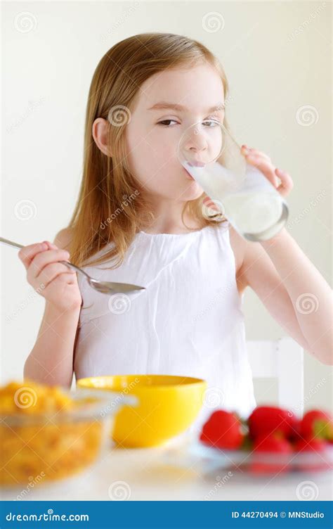 Little Girl Eating Cereal With Milk Stock Photo Image Of Caucasian