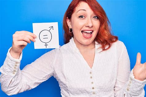 Young Redhead Woman Asking For Sex Discrimination Holding Paper With