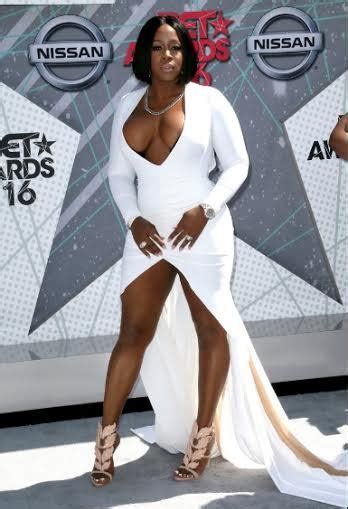 Rapper Remy Ma Struggles To Contain Her Ample Assets In Plunging White