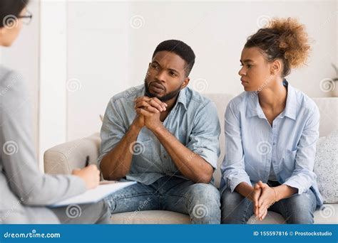 African American Couple Listening To Psychologist`s Advice On Therapy