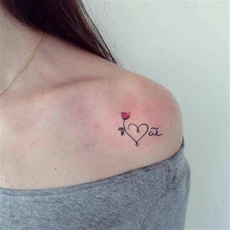 A Woman With A Small Tattoo On Her Shoulder That Says I Love You In The