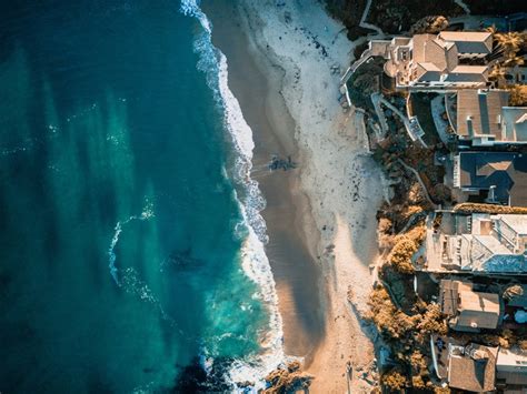 Drone Aerial View Of The Ocean Sand Beach And Houses On The Laguna