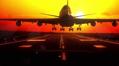 Airplane Landing At Sunset Long Focus Lens Stock Motion Graphics Sbv