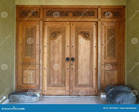 The Door Is Made Of Teak Wood With Ancient Javanese Carving Motif Stock