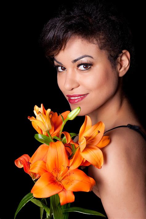 Woman With Lily Flowers Photograph By Artur Bogacki Fine Art America