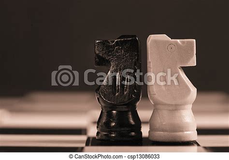 Two Chess Knights Facing Away From Each Other On Chess Board Canstock