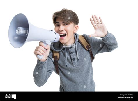 Cheerful Male College Student Shouting Through Megaphone Stock Photo