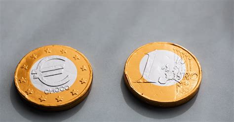 Coins One Euros Lying On Gray Table · Free Stock Photo