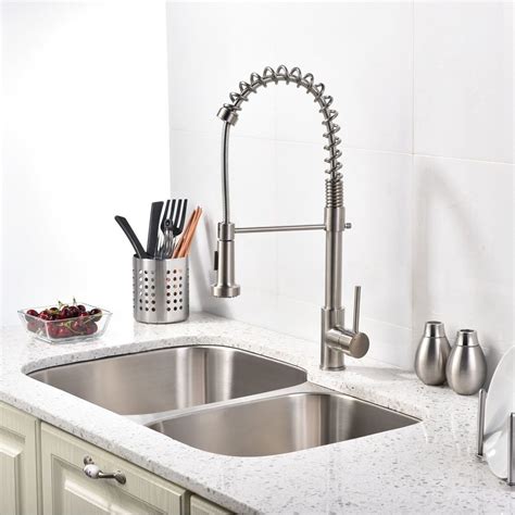 A faucet with a ceramic disk valve and solid brass base materials will be the most durable. Brushed Nickel Kitchen Sink Faucet with Pull Down Sprayer