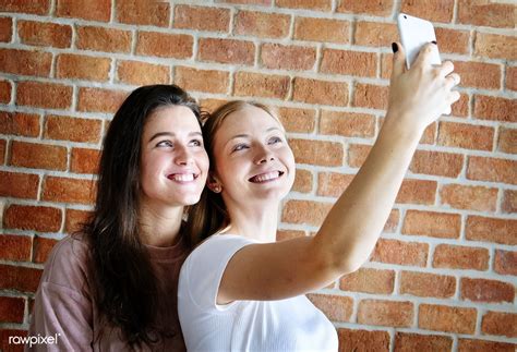 Smiling Female Friends Taking A Selfie Premium Image By