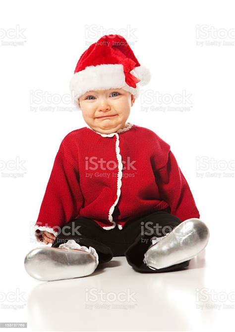 Sad Baby Girl Wearing A Santa Hat Stock Photo Download Image Now