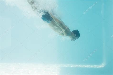 Shirtless Man Swimming Underwater Stock Photo By Wavebreakmedia 102596144