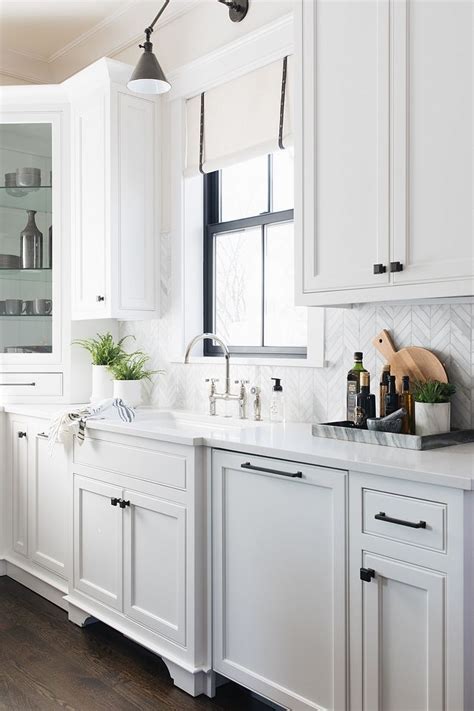 White shaker cabinetry with black countertops and glass by south shore decorating. Black Cabinet Hardware Kitchen Cabinet Hardware source on Home Bunch #Kitchen #Cabine ...