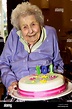 Elderly woman in wheelchair holding her birthday cake celebrating her ...