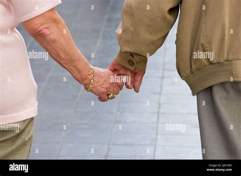Seniors Holding Hands Stock Photo Alamy
