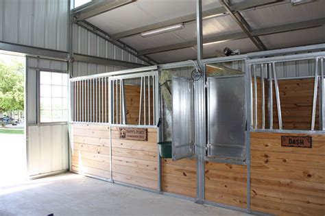 The Raised Center Aisle Barn Features A Breezeway With Sliding Doors