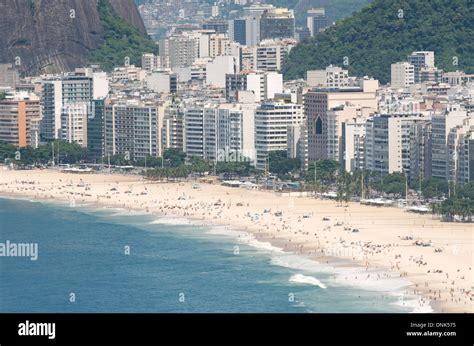 Tropical View Of Copacabana Beach With City Skyline Of Rio De Janeiro