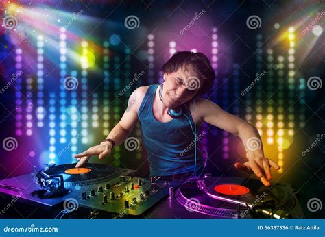 Dj Playing Songs In A Disco With Light Show Stock Photo Image Of