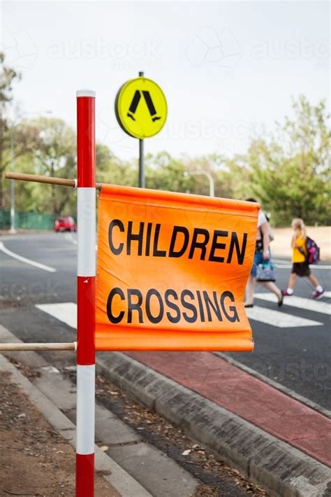Image Of Children Crossing Sign At Zebra Crossing Beside Aussie Public