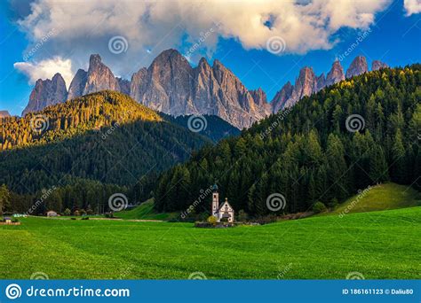 Landscapes With San Giovanni Church And Small Village In Val Di Funes