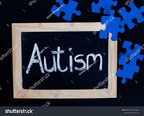 Word Autism Handwritten On Chalkboard Blue Stock Photo 2132976941