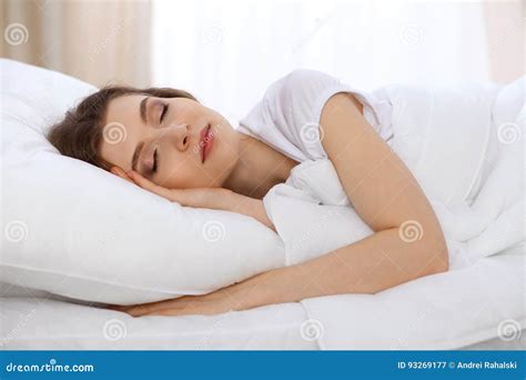 Beautiful Young Woman Sleeping Lying In Bed And Relaxing In The Morning