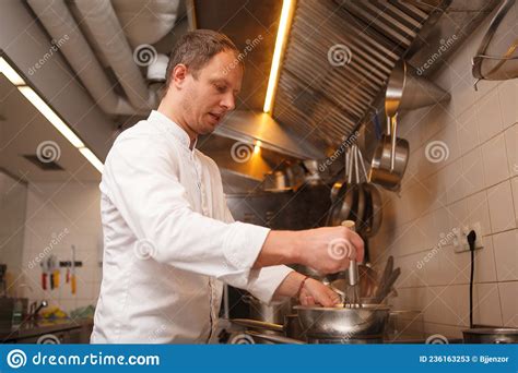 Professional Chef Cooking At The Kitchen Stock Image Image Of