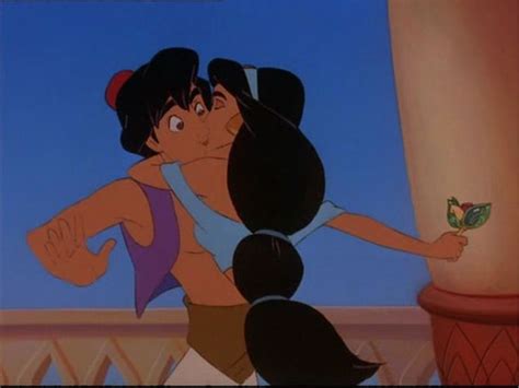 Jasmine Kisses Aladdin After He Gave Her A Jeweled Flower Disney