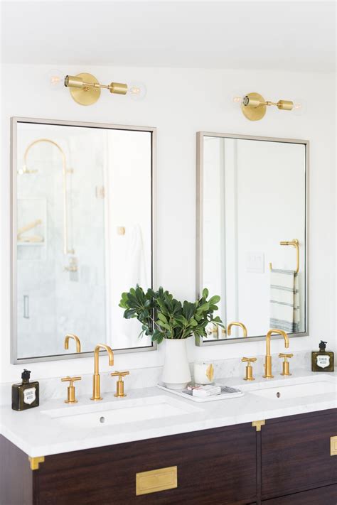 Our gold bathroom fixtures add a luxurious touch to any bathroom. U-Street | Modern white bathroom, Bathroom sconces ...