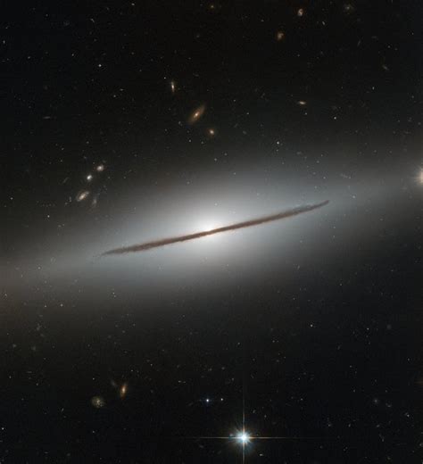 Edge On View Highlights Galaxys Dust Lanes Hides Spiral Structure