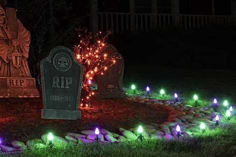 Halloween Decorating Idea Purple And Green String Lights Used To Guide