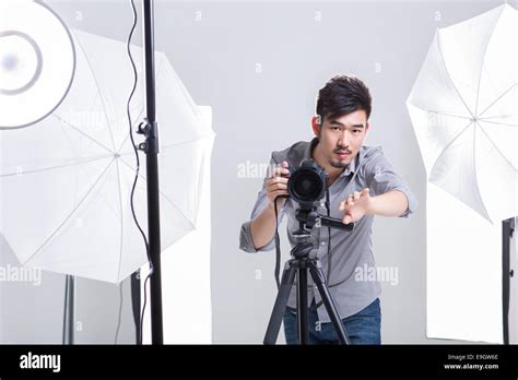 Photographer Taking Picture In Studio Stock Photo Royalty Free Image
