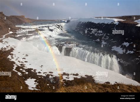 Gullfoss Waterfalls With Rainbow In Mist Above The Canyon Of Hvítá
