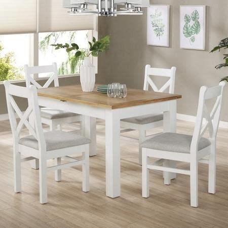 Farmhouse dining tables are often made of wood to give them a rustic country look. White & Oak Extendable Dining Set with 4 White Dining ...