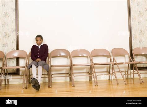 Girl Sitting Alone Stock Photo Alamy