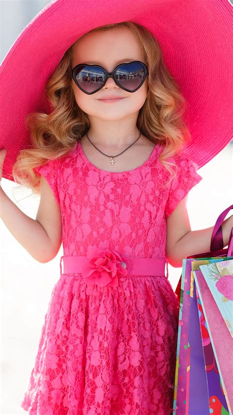 Small Cute Girl Is Wearing Pink Dress And Hat Having Bags In Hand 4k Hd