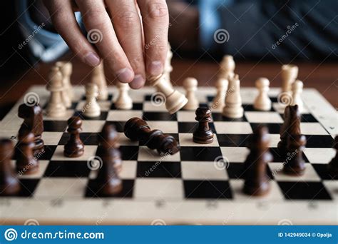 Businessman Play With Chess Game Concept Of Business Strategy And