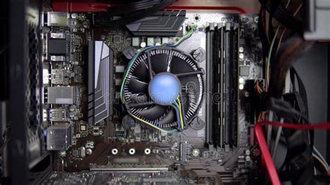 The Processor Cooler On The Motherboard Is Spinning Closeup Cpu