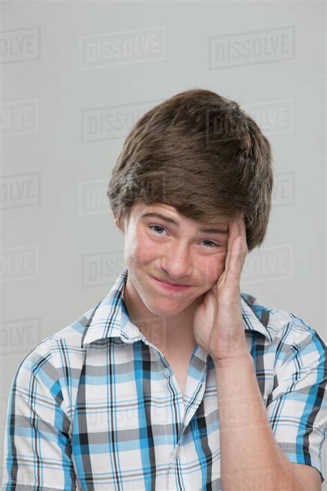 Portrait Of Teenage Boy 14 15 Making A Face Stock Photo Dissolve