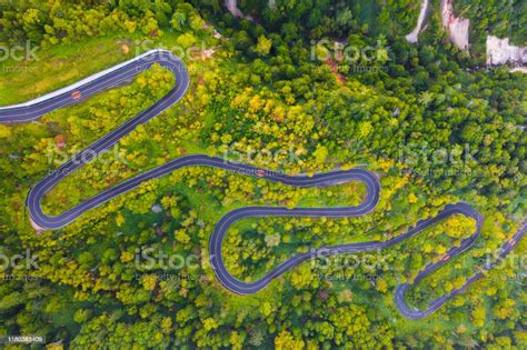 Aerial View Of Winding Road On Mountain In Autumn Stock Photo