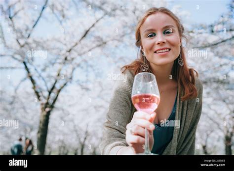 Portrait Of Smiling Woman Enjoying Nature In Spring Picnic Under